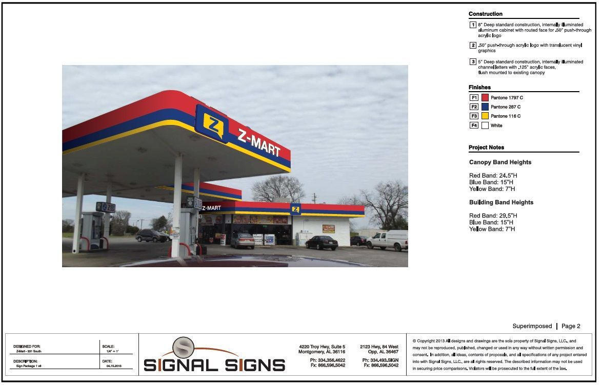 A picture of a gas station with a red , blue and yellow canopy.