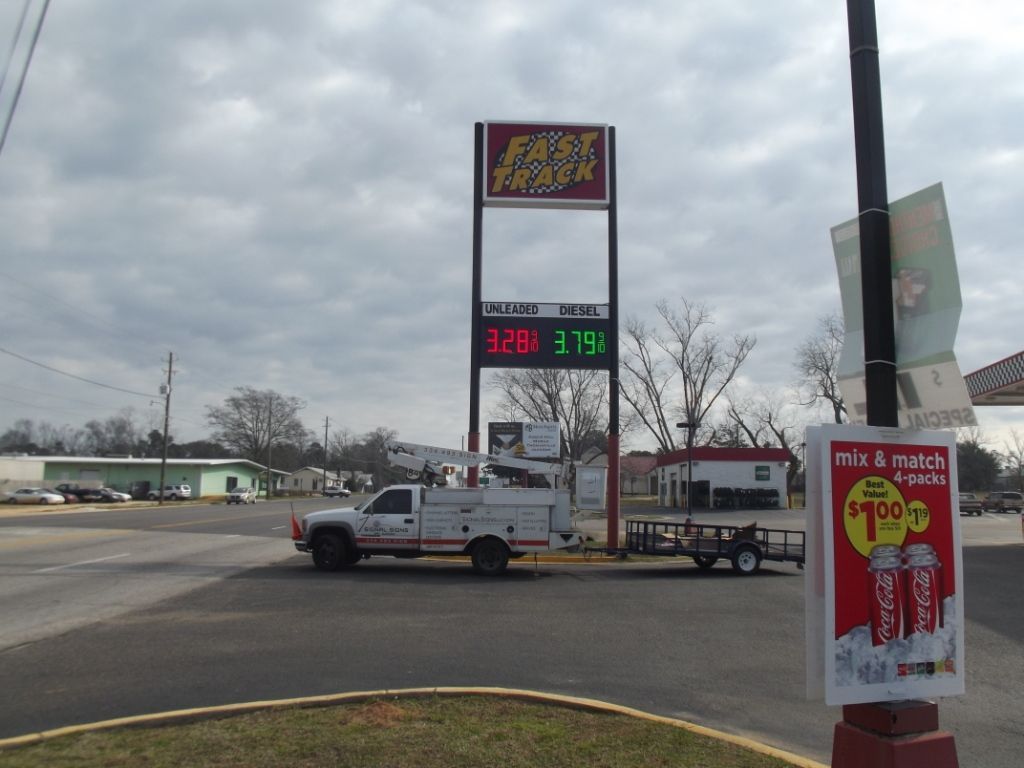 A truck is parked in front of a sign that says first choice