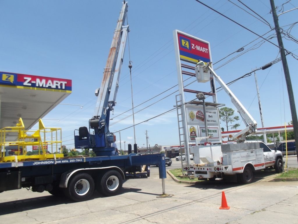 A truck is parked in front of a z-mart gas station