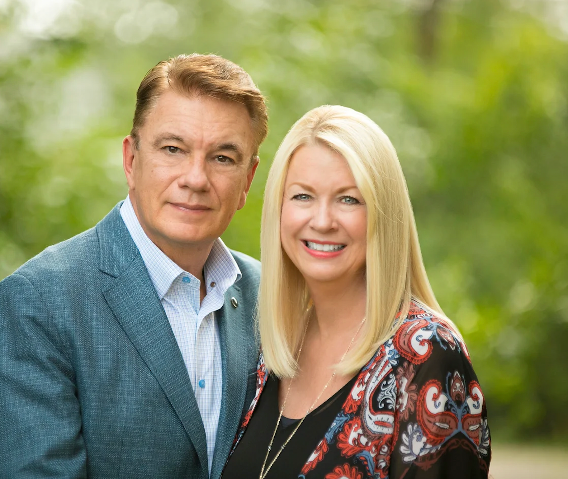 A man and a woman are posing for a picture together.