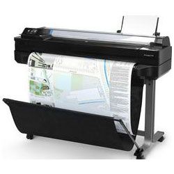 A large printer is printing a large piece of paper.