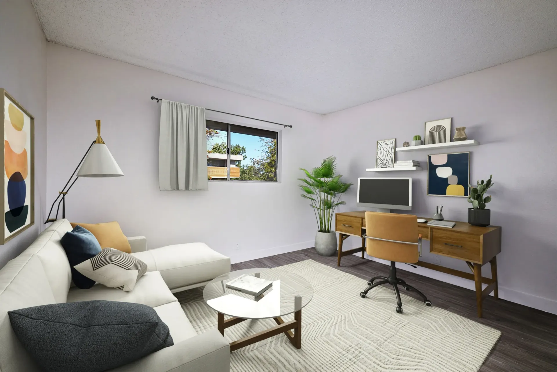 Cozy living room with desk. Light purple walls, white couch, rug, and wooden desk. Sunlight streams from a window.