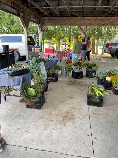 Veggie vendors under the pavillion.