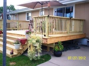 wooden Deck with plants on side - Deck builders in Dyer, IN