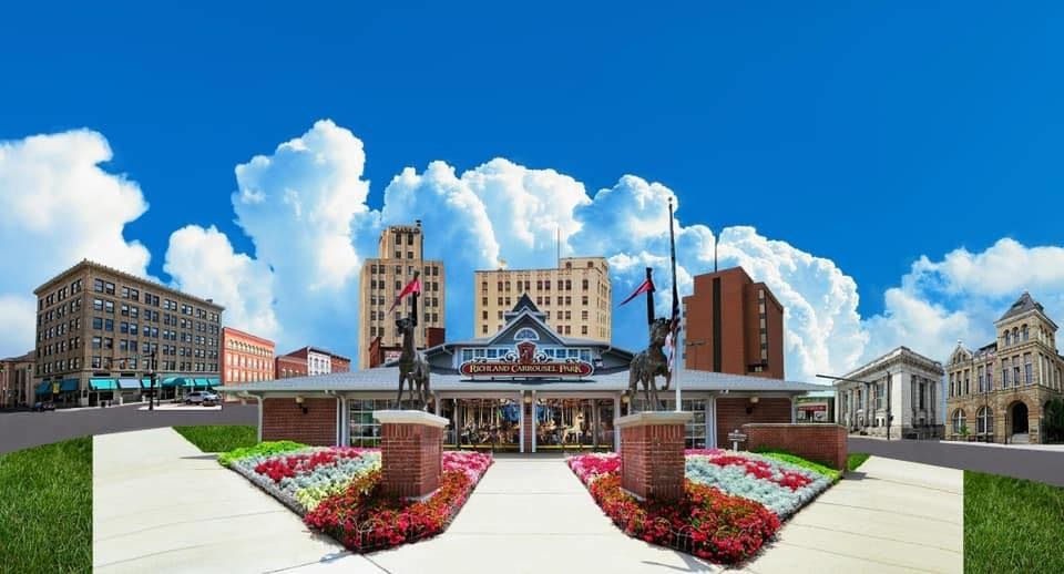 Photo of an entrance to a venue, with a building skyline in the background