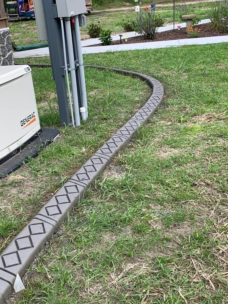 Gray conduit on grass, running from electrical box to generator.
