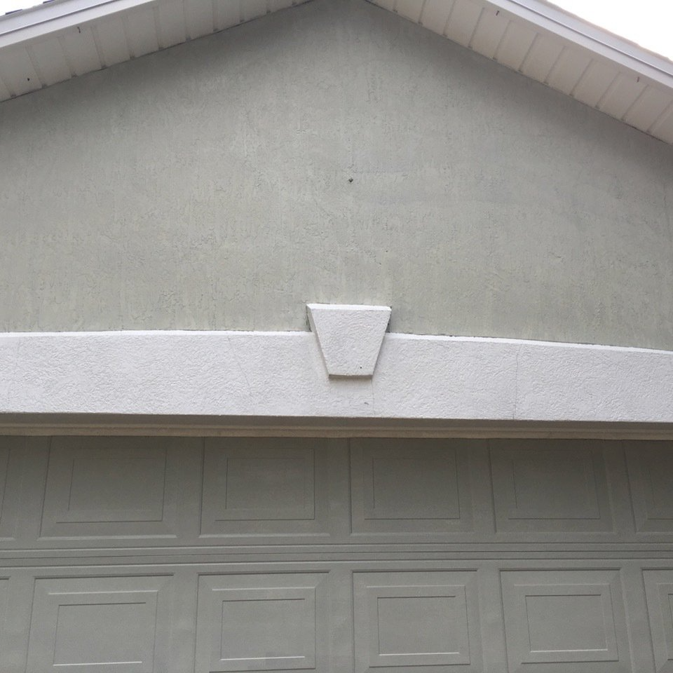 freshly cleaned soffit and garage and stucco
