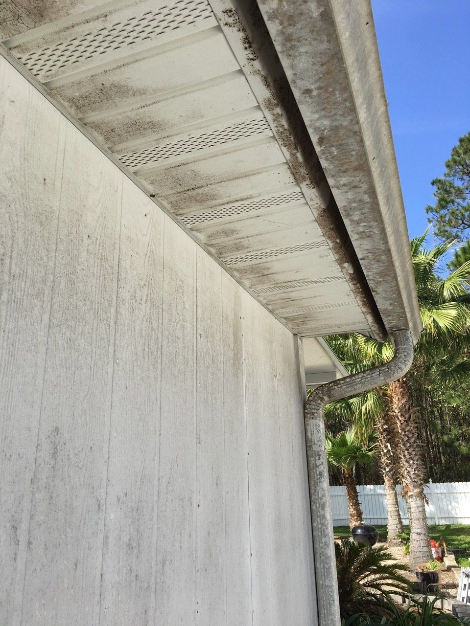 Stewart Pressure Cleaning Before pressure washing service of gutter