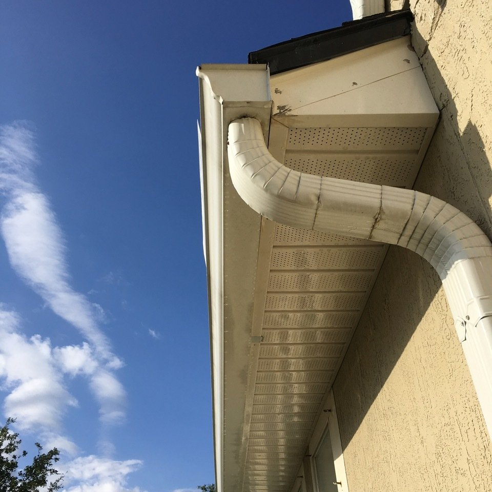 freshly cleaned soffit and stucco on house