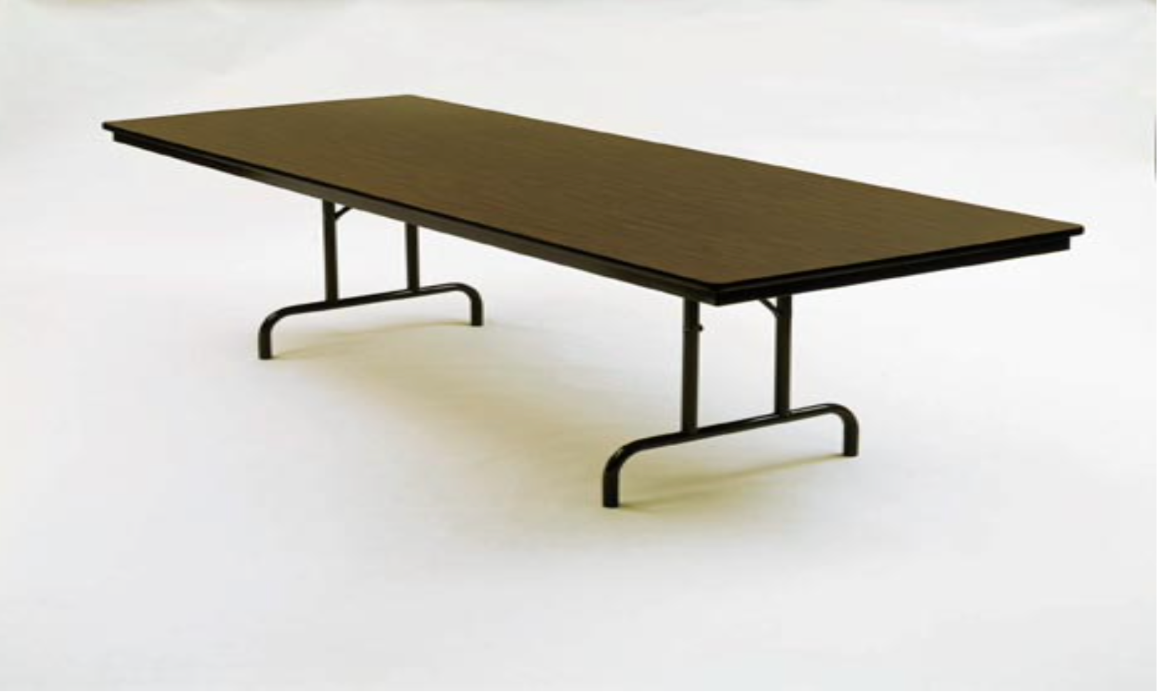 A brown folding table with metal legs is sitting on a white surface.