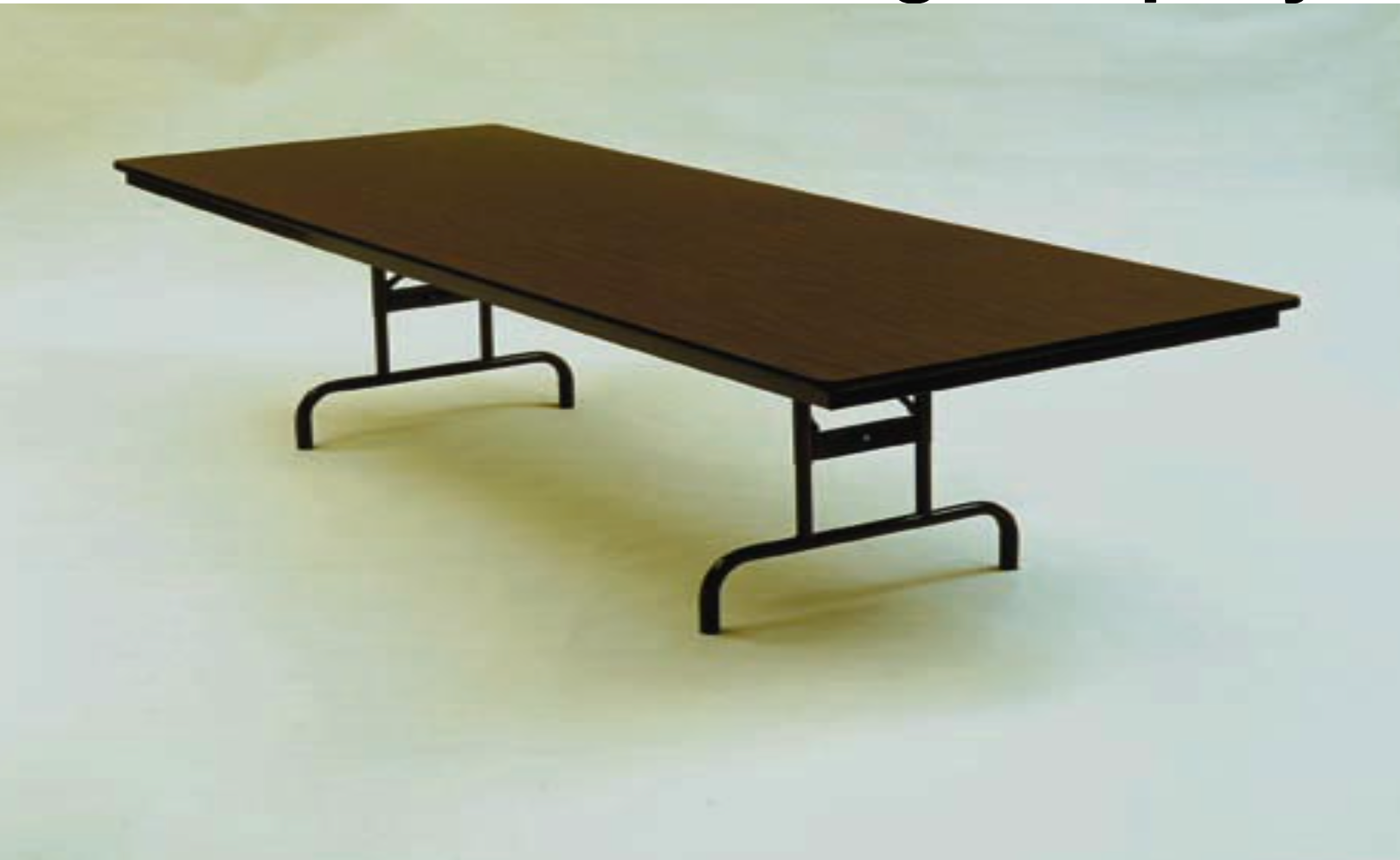 A long brown table with metal legs on a white surface