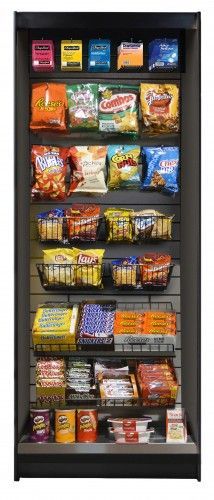 a display case filled with lots of snacks and candy .
