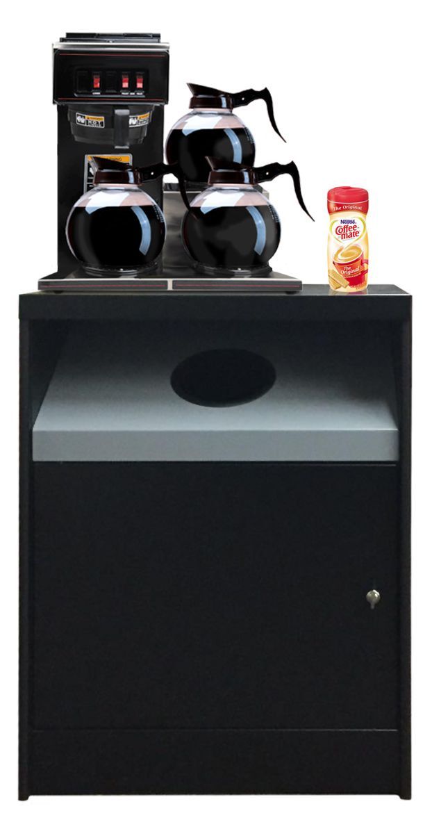 A coffee machine is sitting on top of a table next to a bottle of coffee.