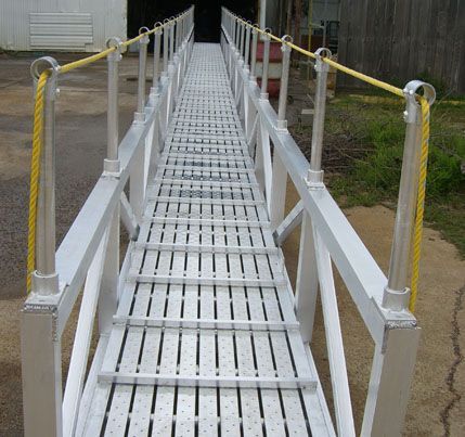 A long metal walkway with a yellow rope attached to it