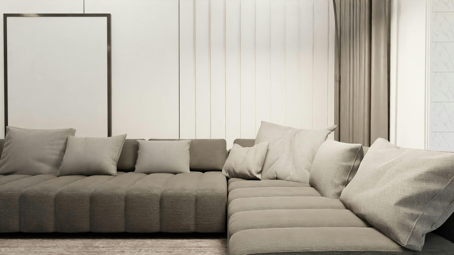 A neutral-toned sectional sofa with several textured cushions in a bright, modern living room.