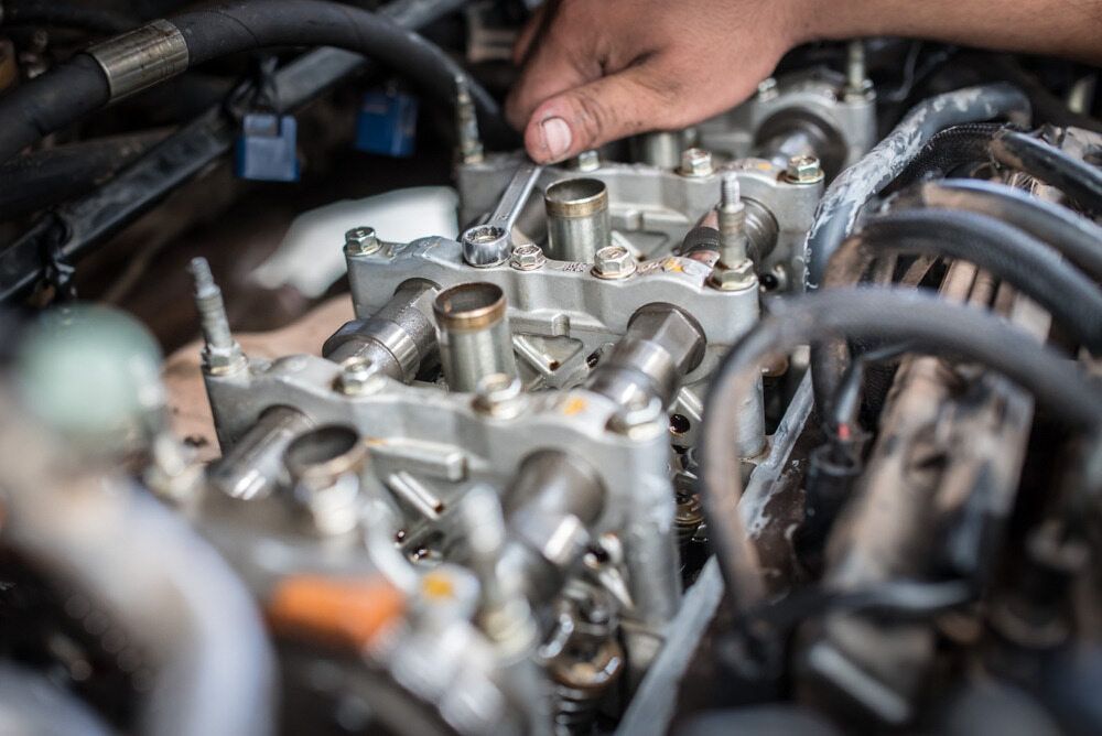 Mechanic Hand Using Wrench on an Engine — Autopro Taree in Taree, NSW