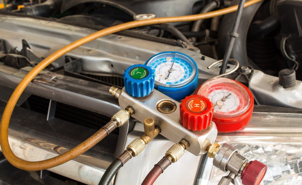 A/C Gauges Connected to a Car, Measuring Pressure; Mechanic Work — Autopro Taree in Taree, NSW