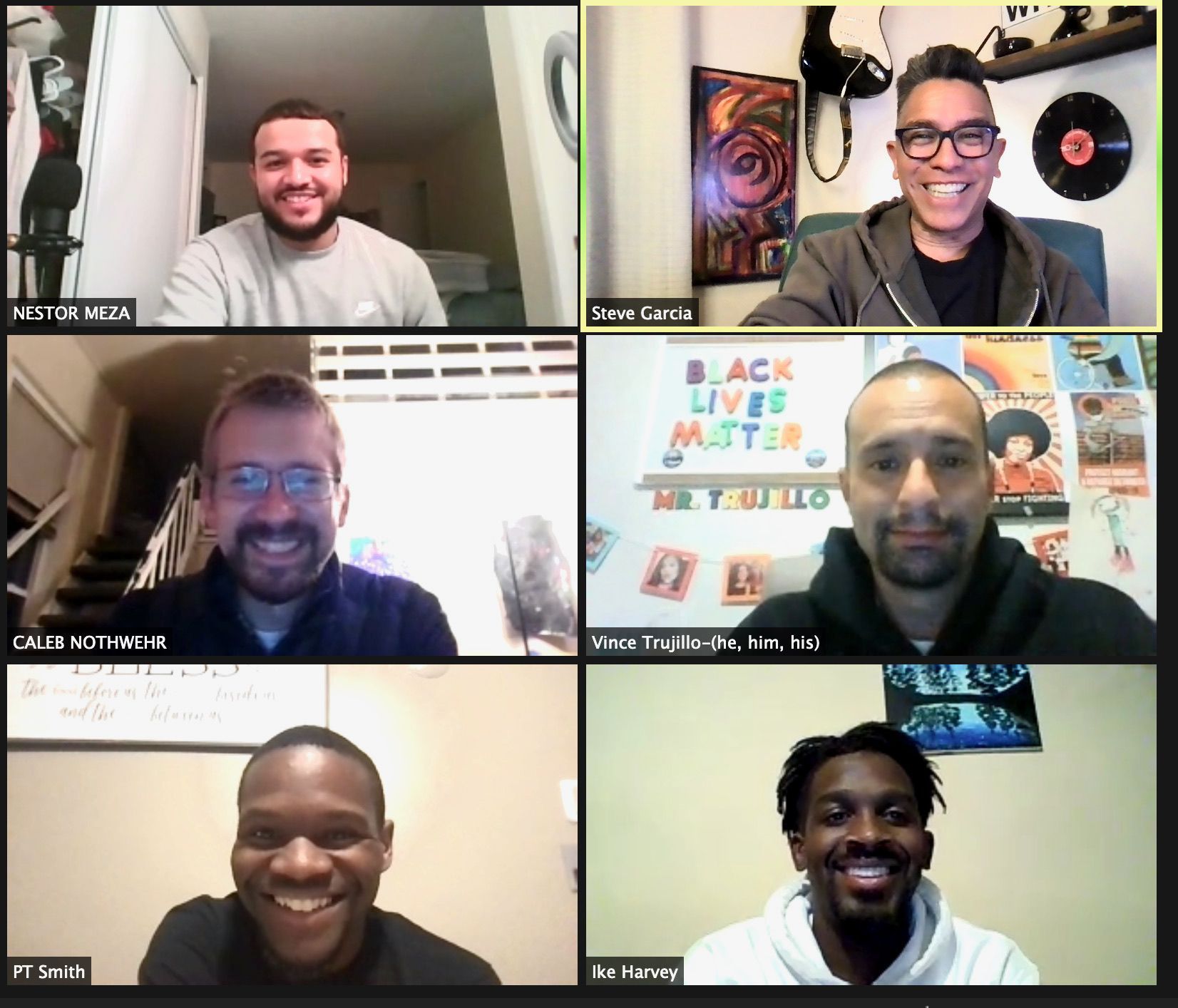 A group of men are on a video call and one of them is wearing glasses