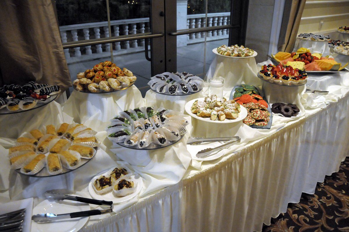 A buffet table with a variety of food on it