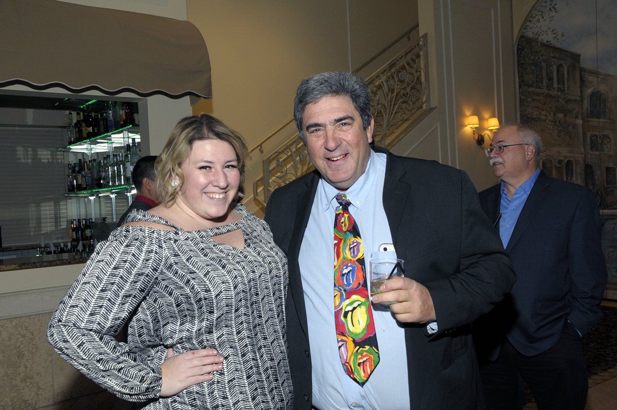 A man and a woman are posing for a picture together