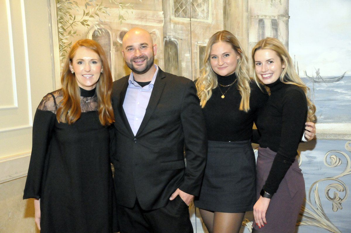 A group of people are posing for a picture together.