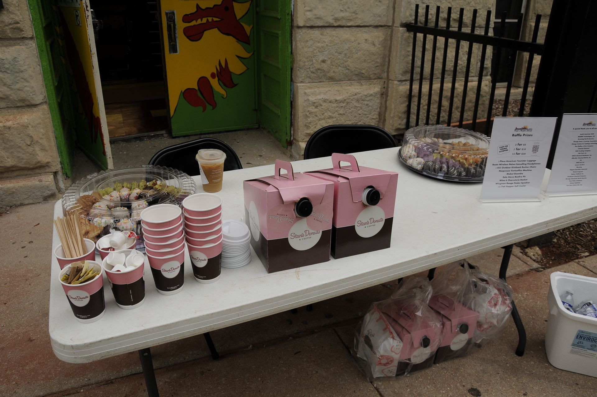 A table with a bunch of cups and boxes on it