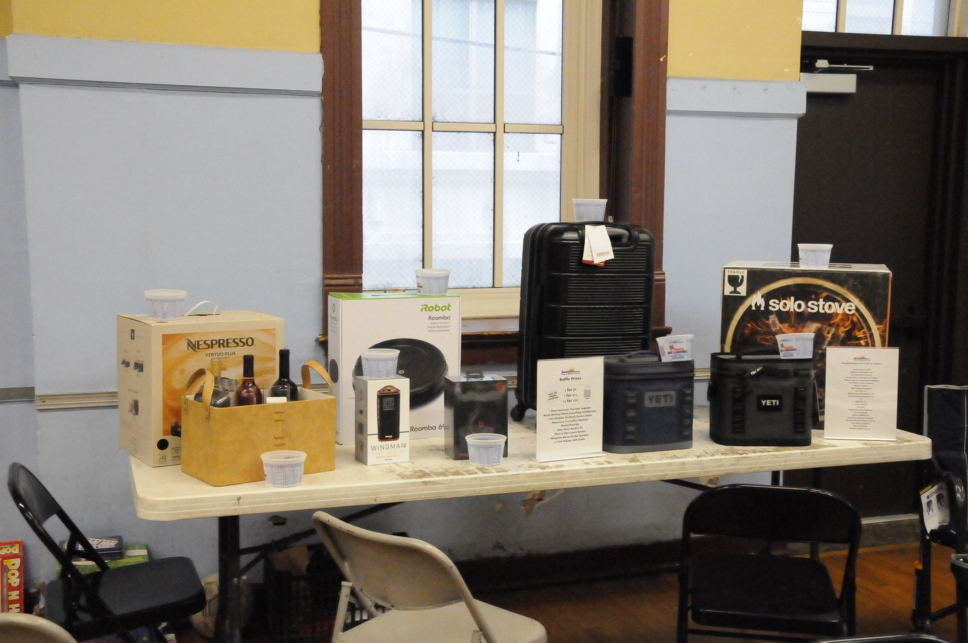 A table with various items on it including a black and decker box