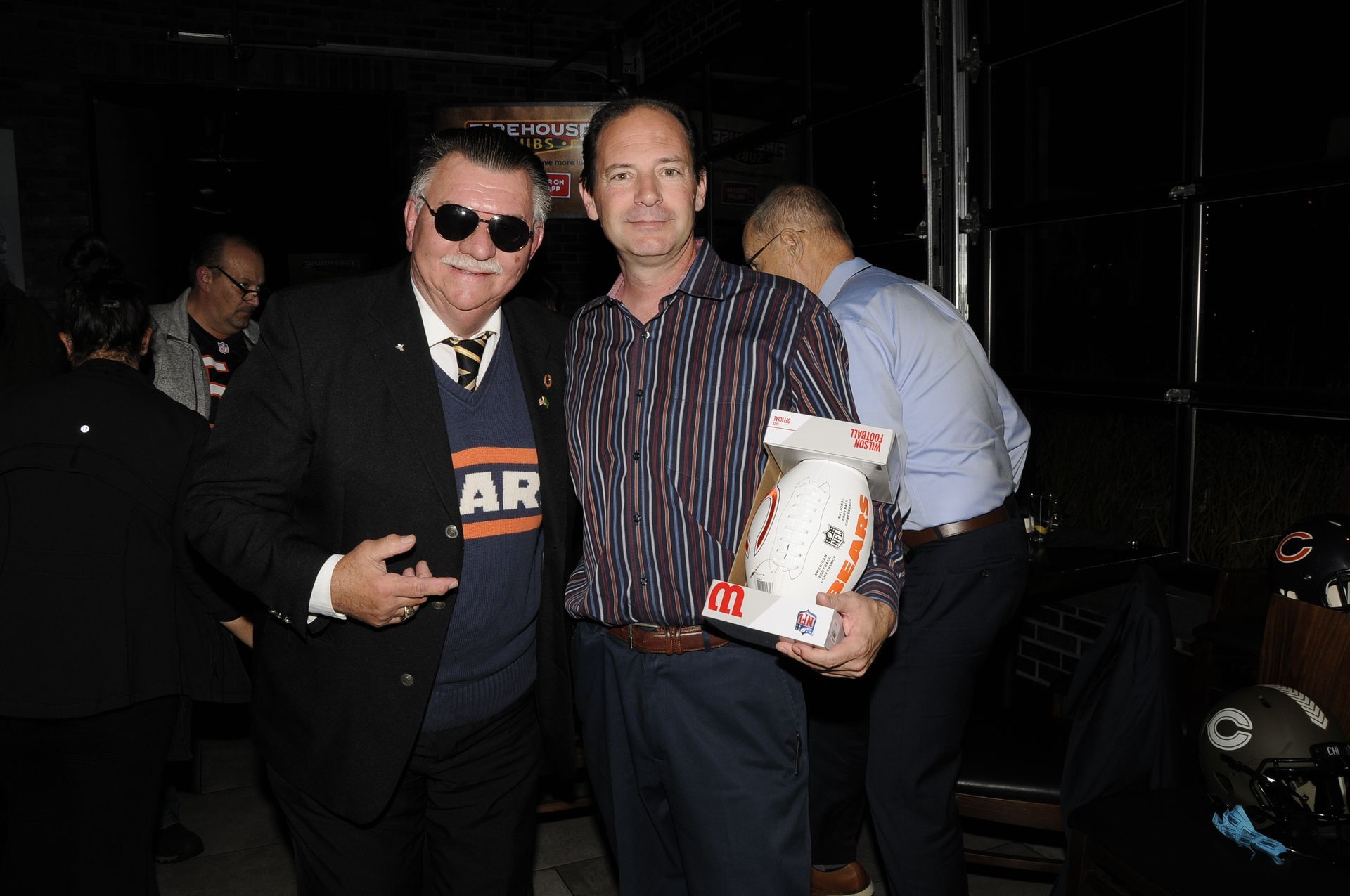 Two men posing for a picture with one wearing a shirt that says ar