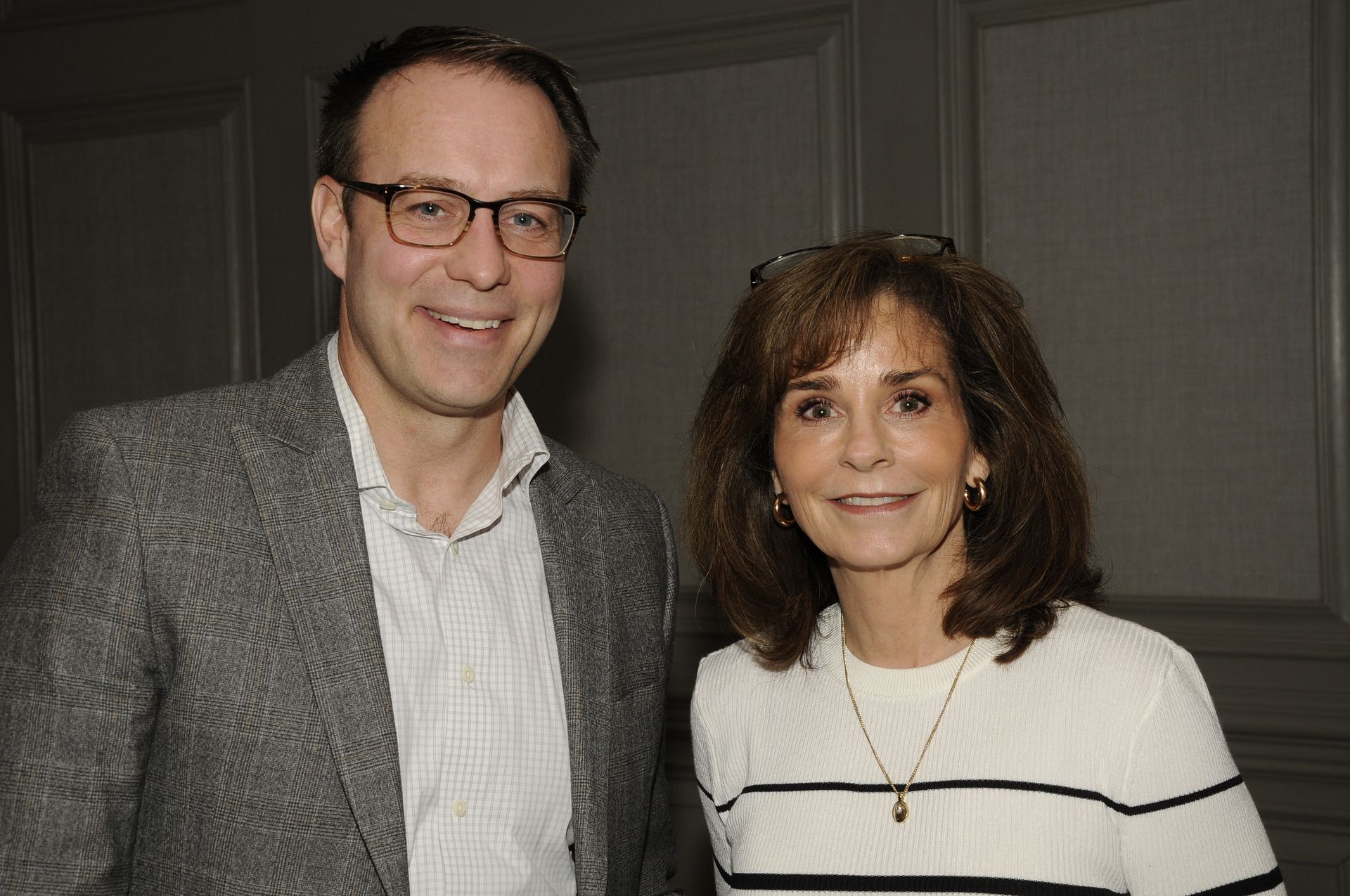 A man and a woman are posing for a picture together.
