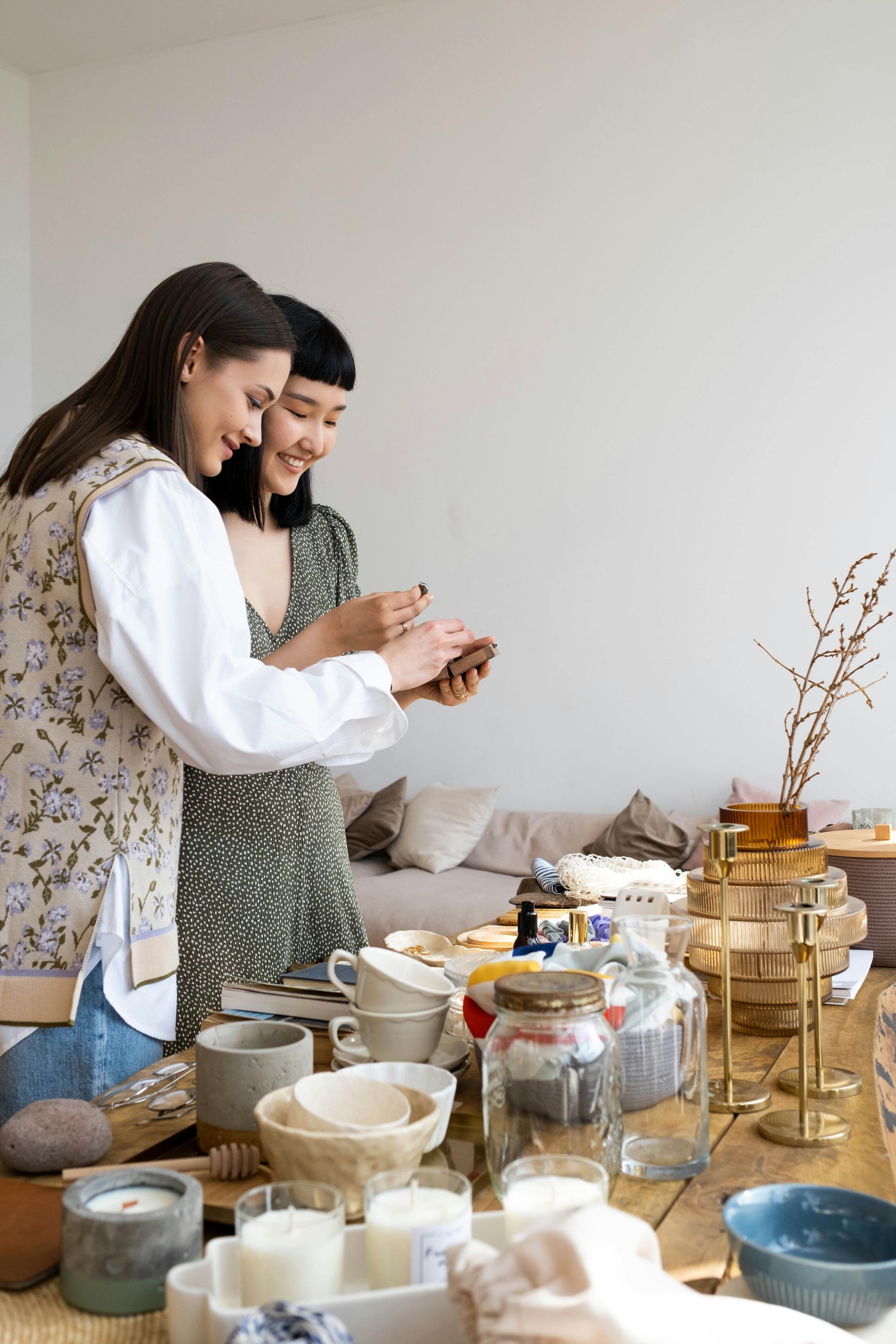 image of two women looking at items