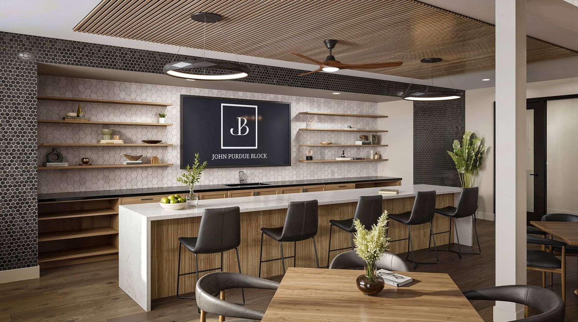 Modern community lounge with a long marble bar, stools, and wooden shelves.