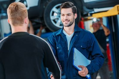 Full Service Auto Repair — Mechanic Welcoming Client in Kokomo, IN