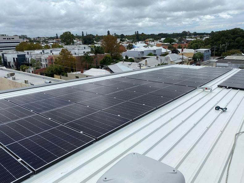 A roof with a lot of solar panels on it