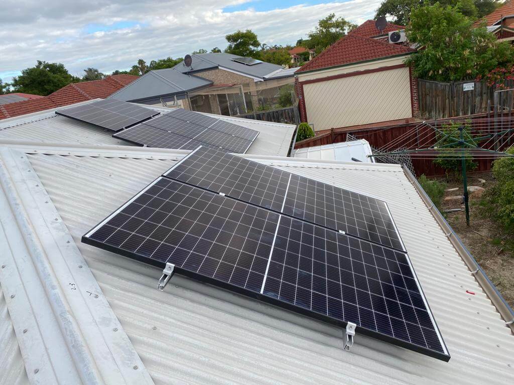 group of residential solar panels on the roof