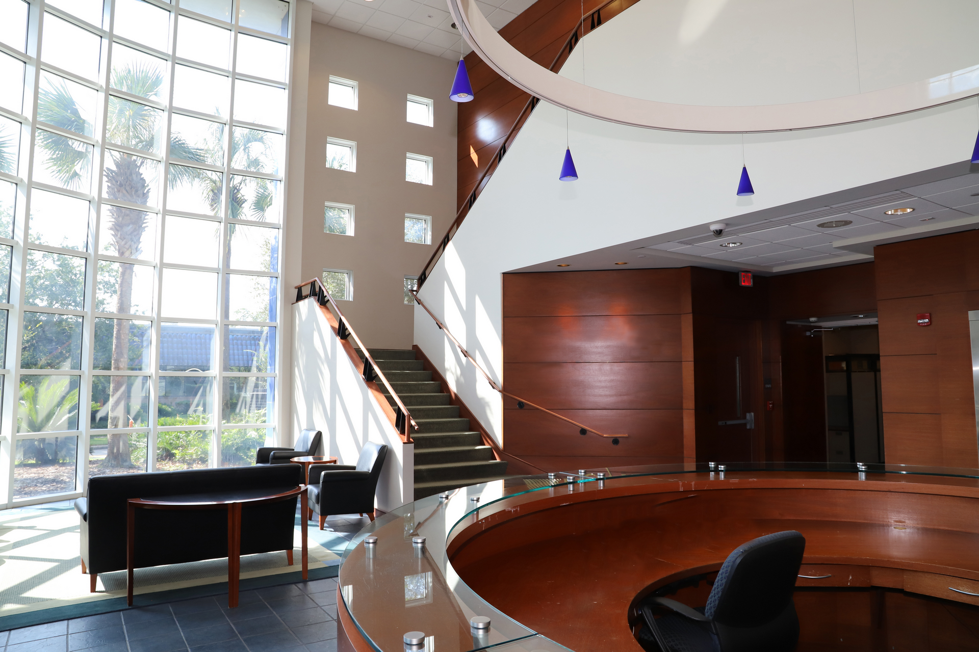 A large lobby with stairs leading up to the second floor