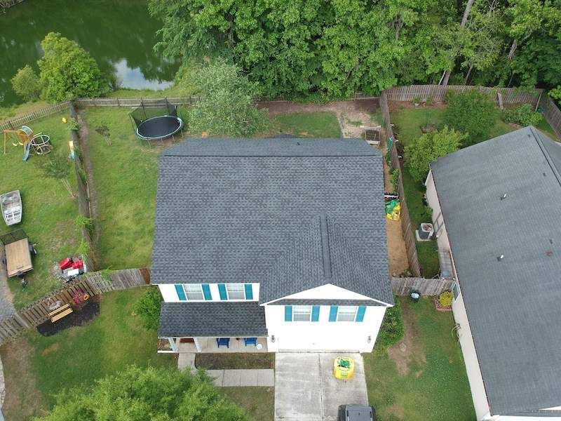 An Aerial View Of A House With A Trampoline In The Backyard — Summerville, SC — Palm & Pineapple Roofing and Exteriors
