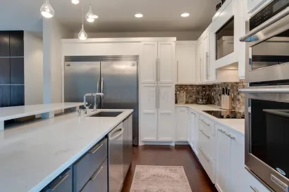 A kitchen with a large island in the middle of it.