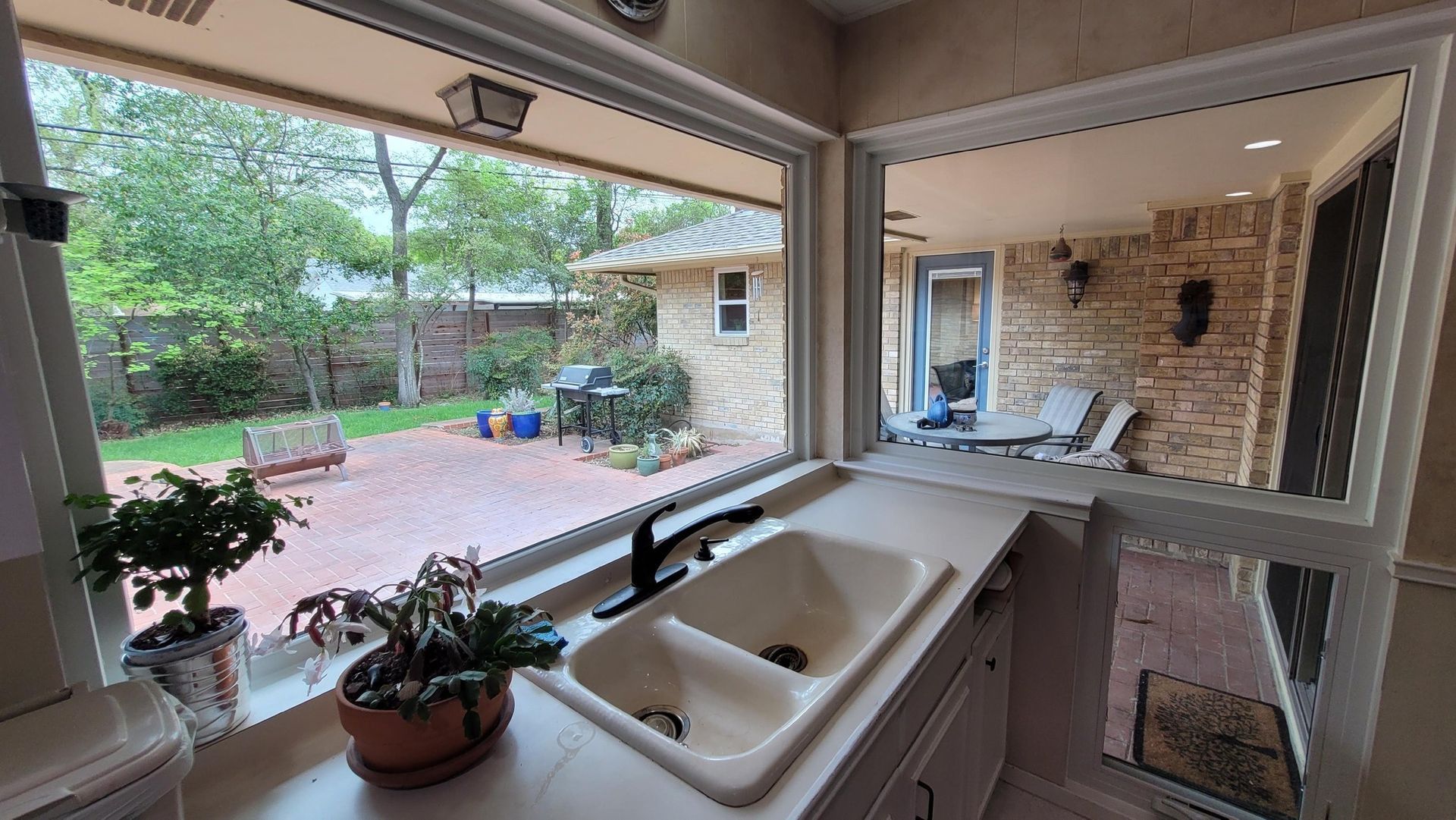 A large deck with sliding glass doors leading to a balcony.