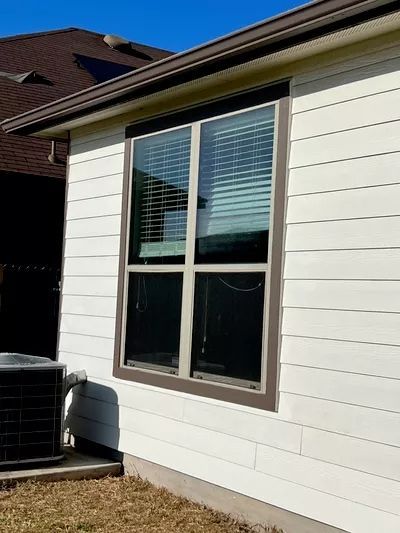 A large deck with sliding glass doors leading to a balcony.