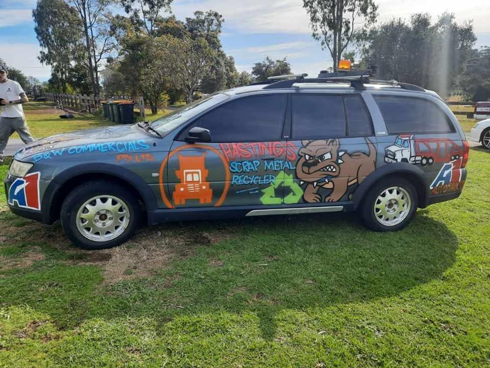 A Car With Scrappy Dog On It— Hastings Scrap Metal Recyclers in Port Macquarie, NSW