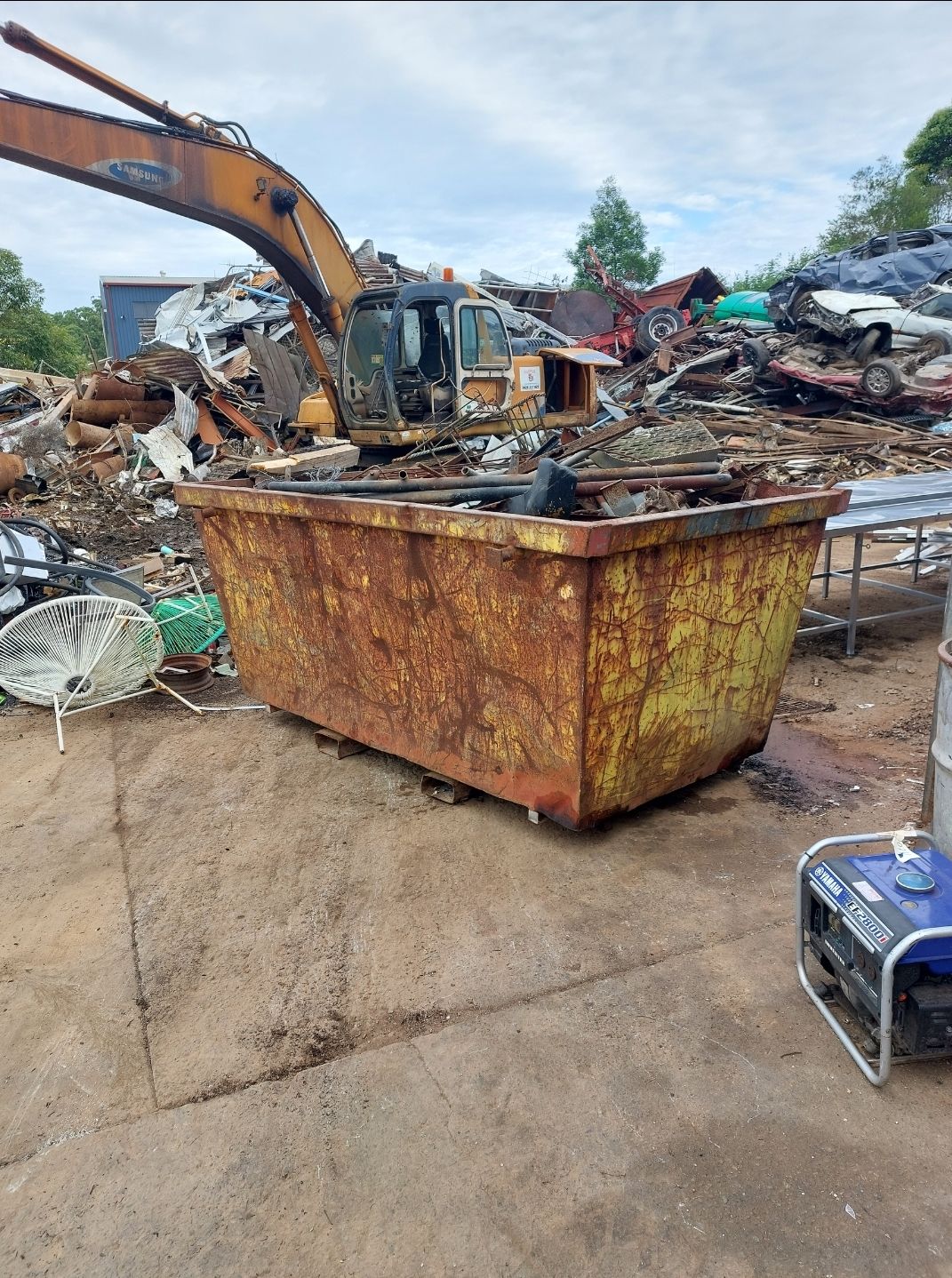 A Large Yellow Bin of Scrap Metal — Hastings Scrap Metal Recyclers in Wauchope, NSW