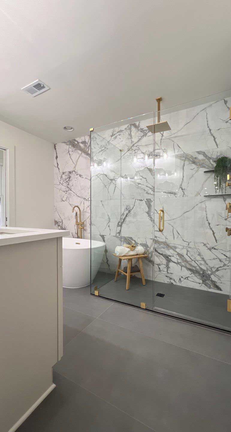 A bathroom with a sink , toilet and mirror.