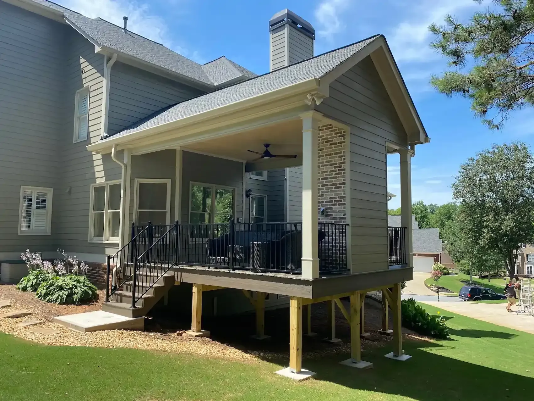 A house with a porch and stairs in front of it