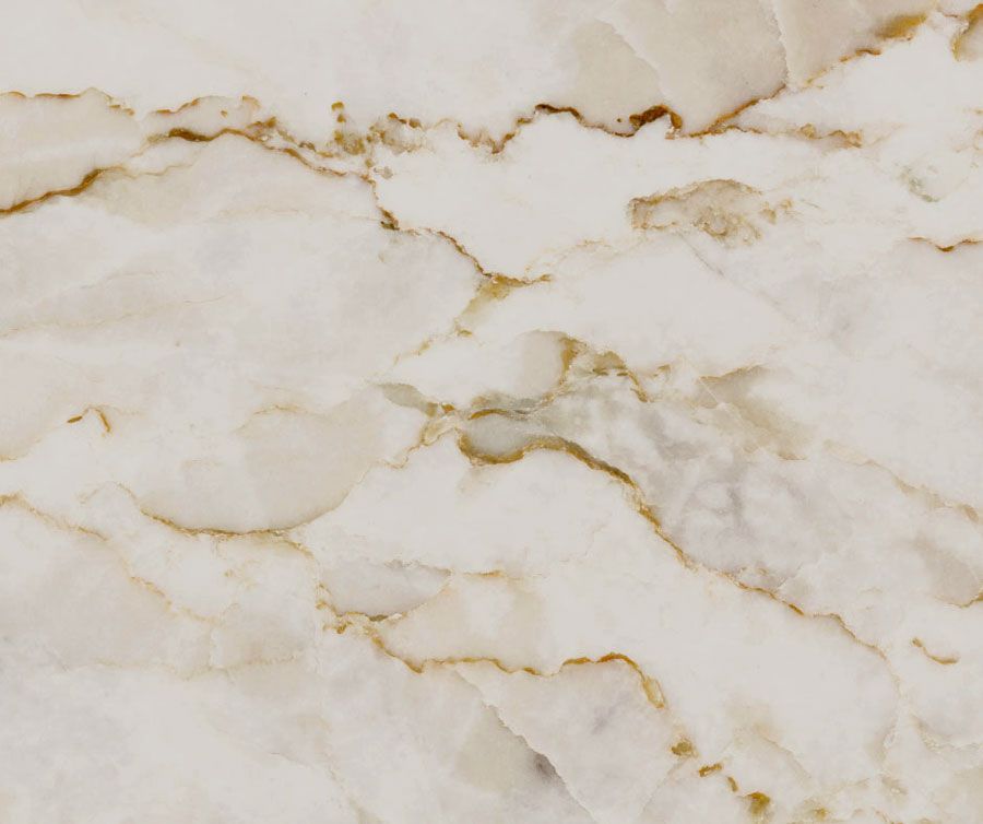 A close up of a white and gold marble texture.