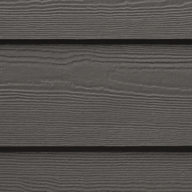 A close up of a gray siding on a house.