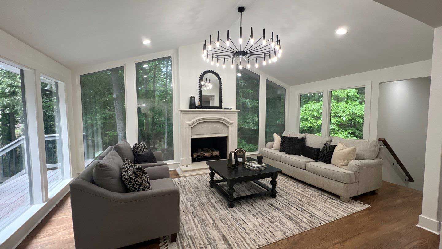 A living room filled with furniture and a fireplace.