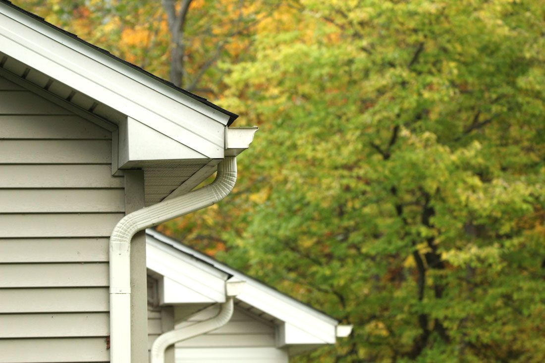 A house with a gutter on the side of it