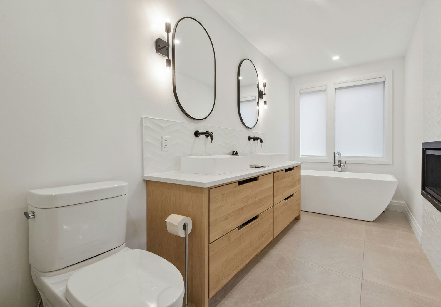 A bathroom with a toilet , sink , and bathtub.