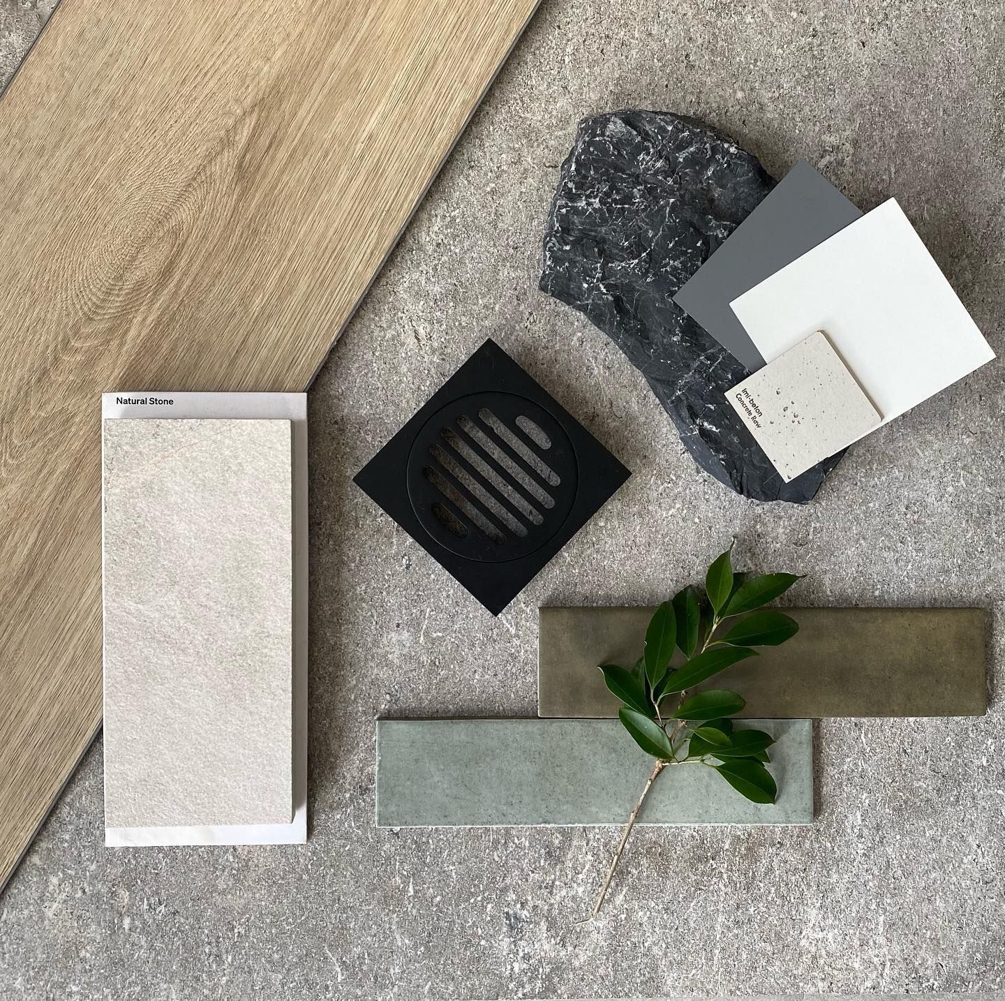 Bathroom design elements with tile samples, soap, and greenery. Beige, white, and gray colors are dominant — Cooloola Tile Company in Gympie, QLD