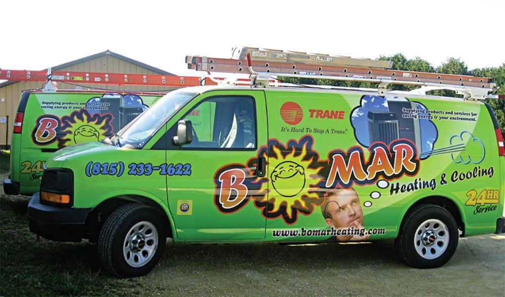 A green van with the word boomer on it